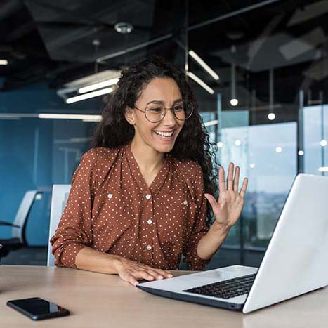 Successful and beautiful hispanic woman working inside modern office building